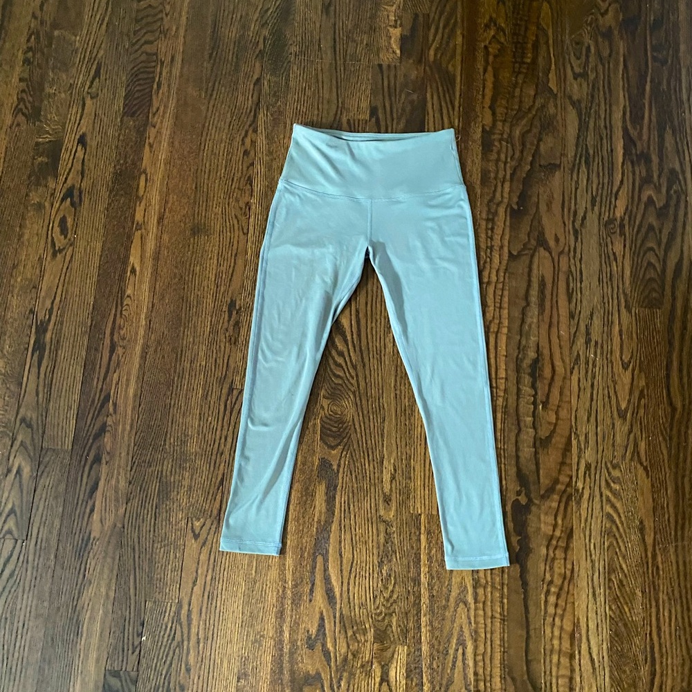 Greenish blue spandex exercise pants